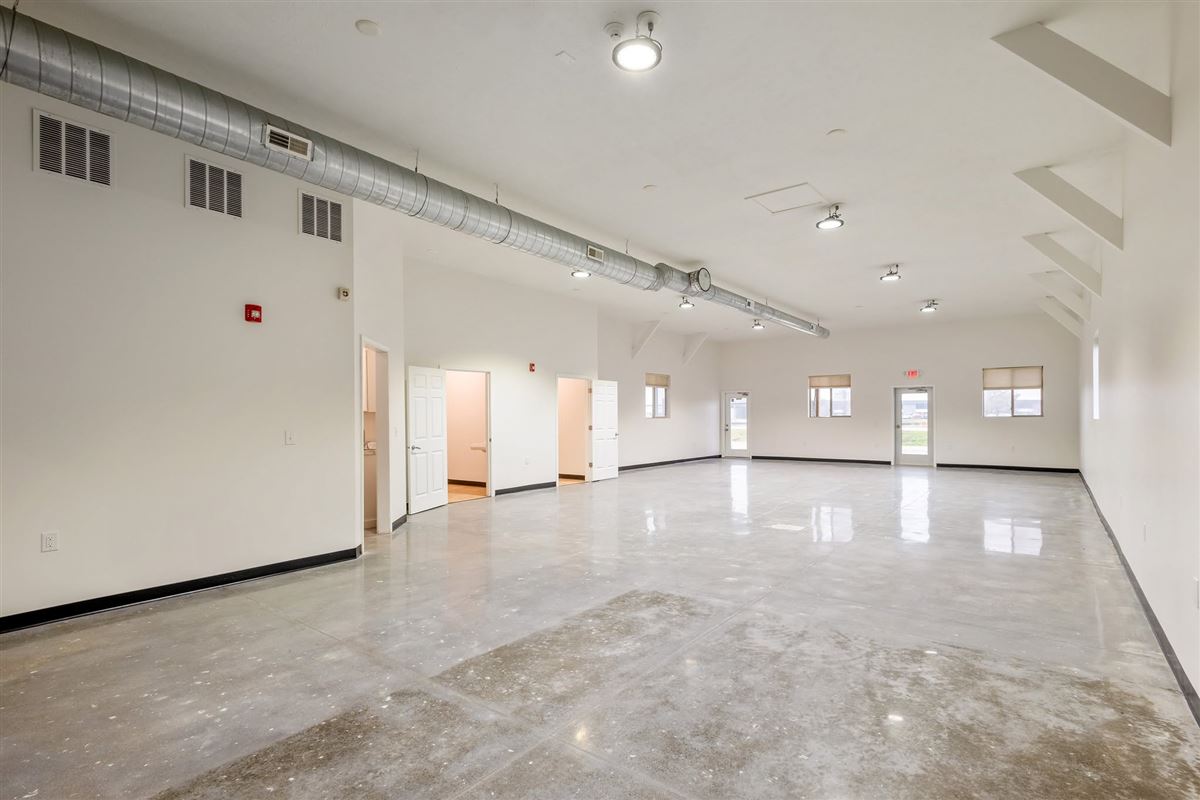 Open floor plan of Valley Venue event space with exposed ductwork and polished concrete