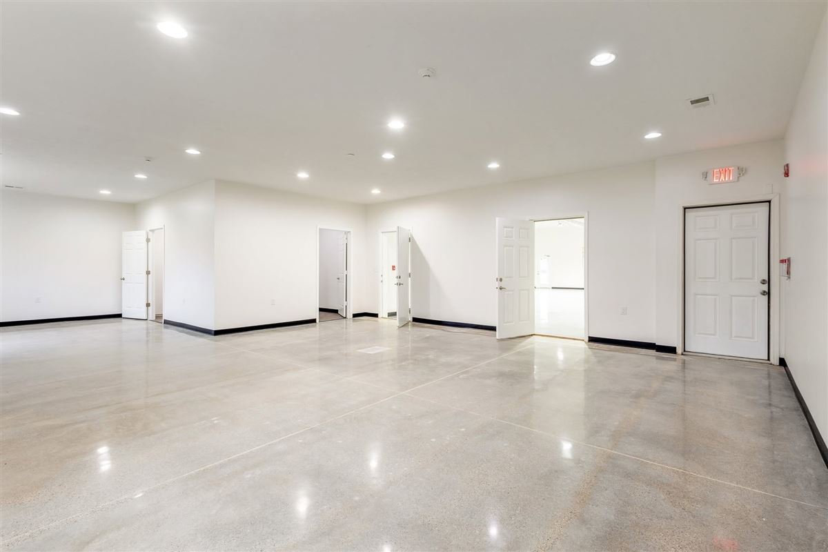 Bright white event hall interior at Valley Venue with polished concrete floors